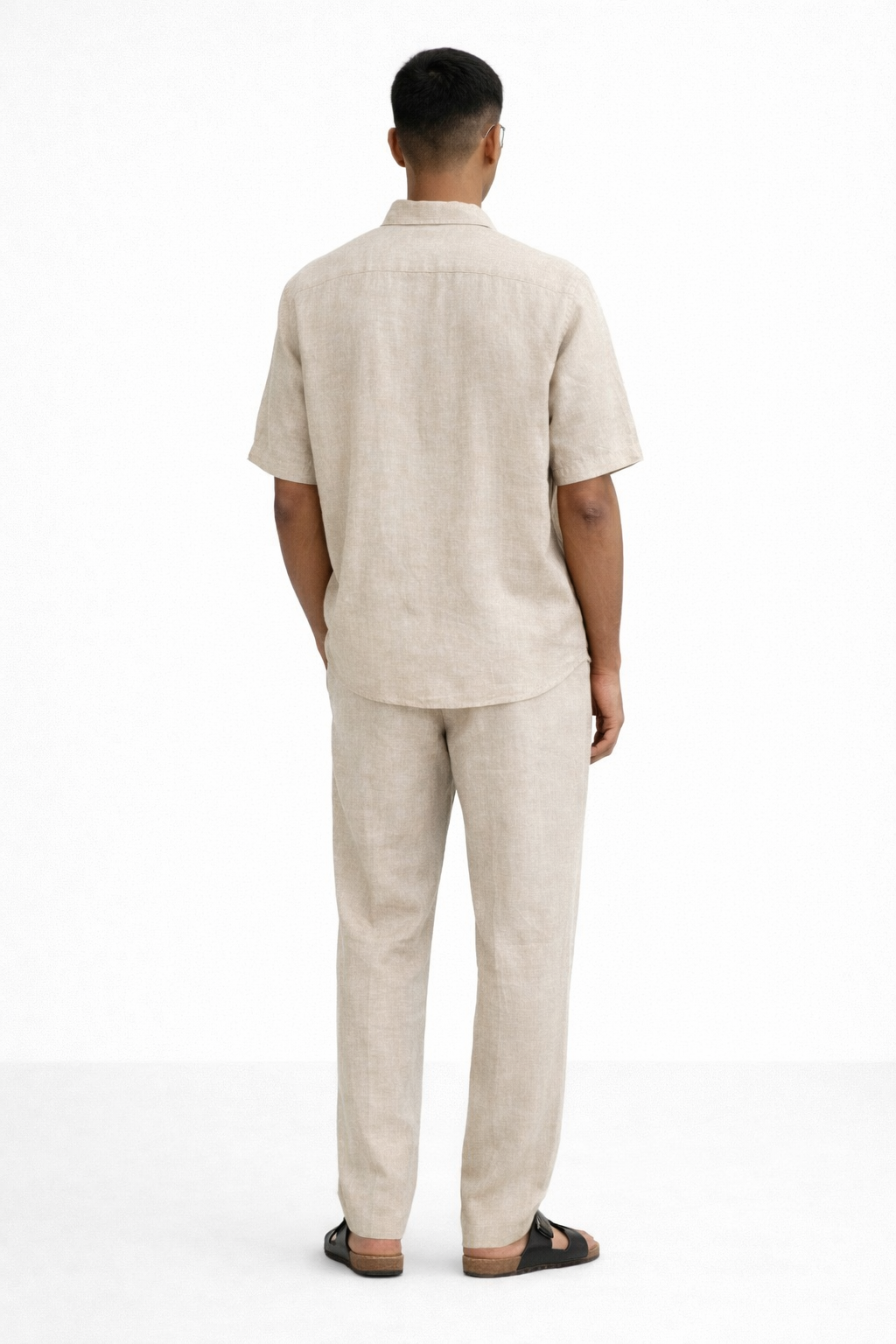 Back view of earthy natural linen shirt and pants set showcasing clean silhouette