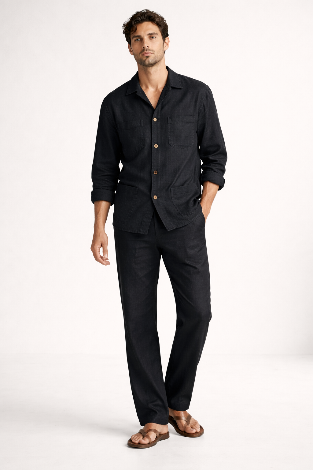 Detail shot of wooden buttons and patch pockets on midnight black linen overshirt