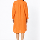 Angarika women's orange linen shirt dress back view showing pleat and linen texture