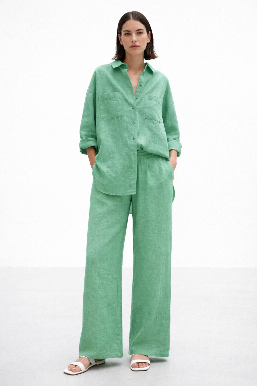 Aura Green Linen Set for women featuring a relaxed linen shirt and wide-leg pants in a soft green hue