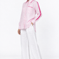 Baby pink linen shirt with satin detailing for women 45 degree view