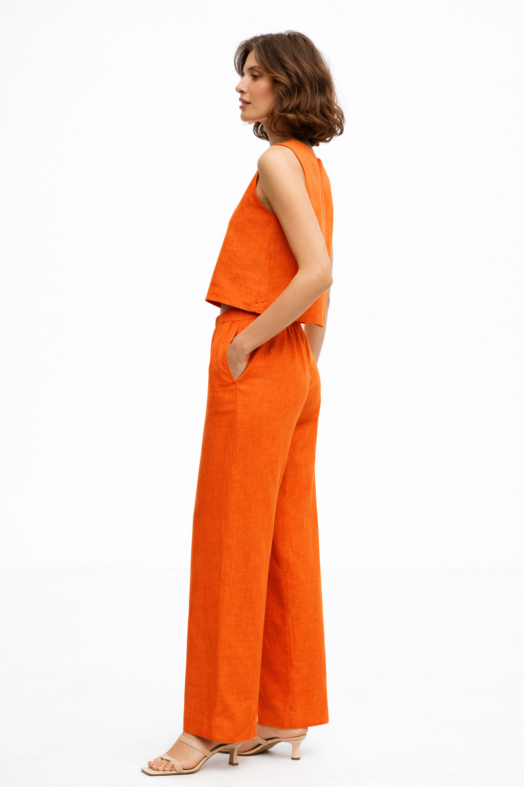 Side view of Casa linen set showing sleeveless top and high-waist linen pants