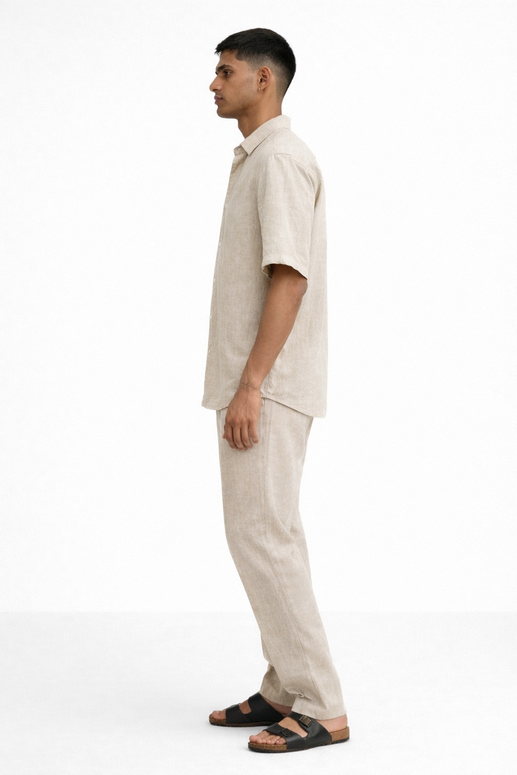 Side view of earthy natural linen half sleeve shirt and pants set for men