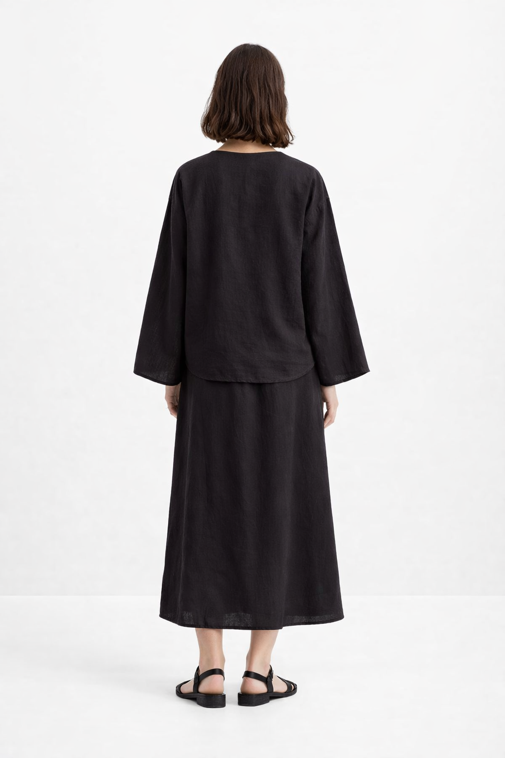 Back view of Eclipse Black Linen Set highlighting the clean silhouette and premium black linen texture.