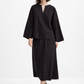Model walking in Eclipse Black Linen Set crafted from pure linen with a relaxed silhouette and elegant drape.