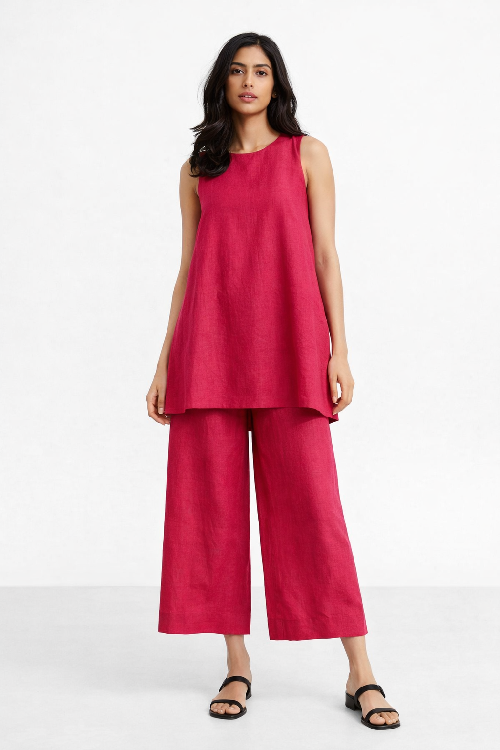 Evara linen set for women featuring a sleeveless pink linen tunic and wide-leg pants, front view