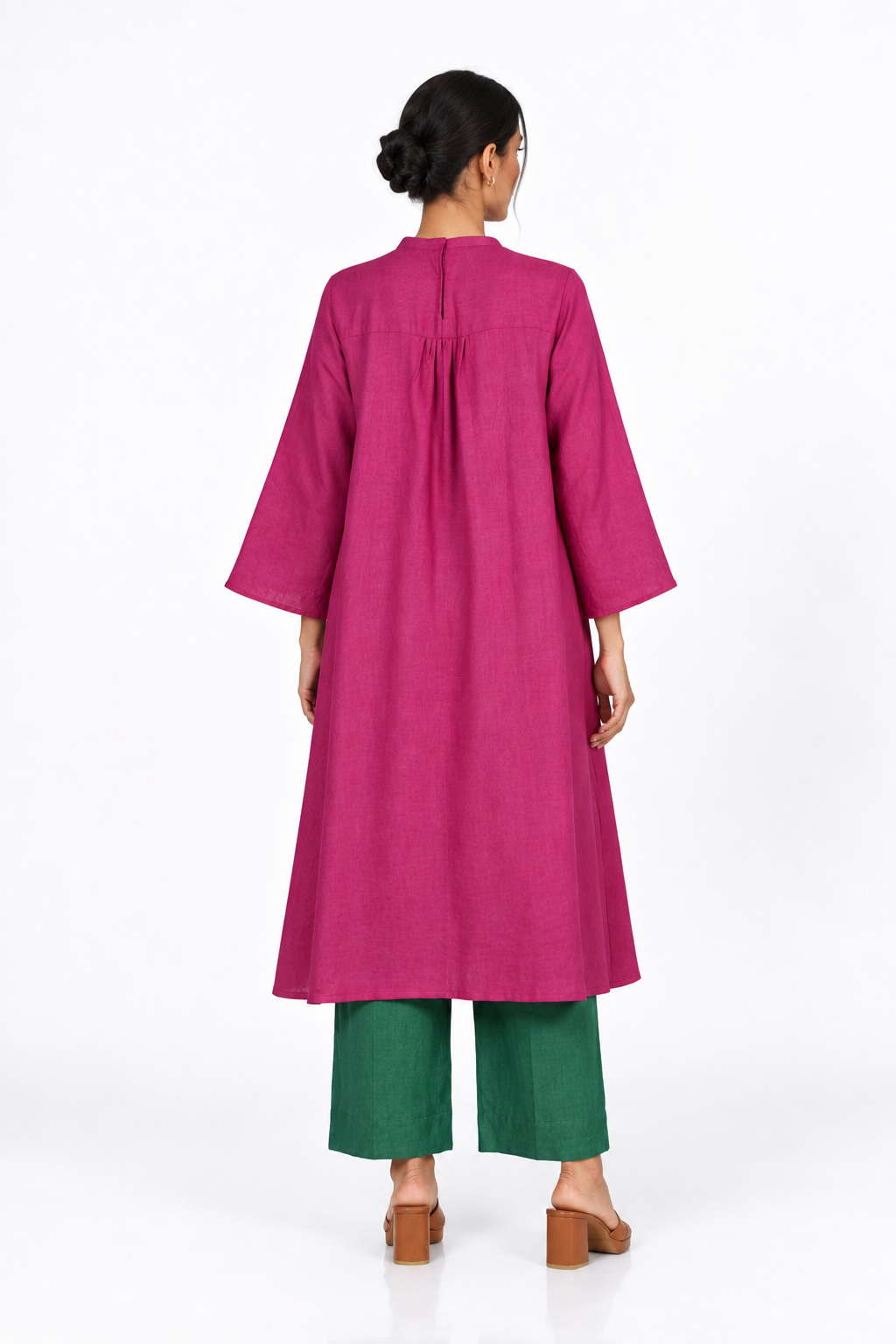 Back view of Gulbahar Rani pink linen tunic with bottle green linen pants