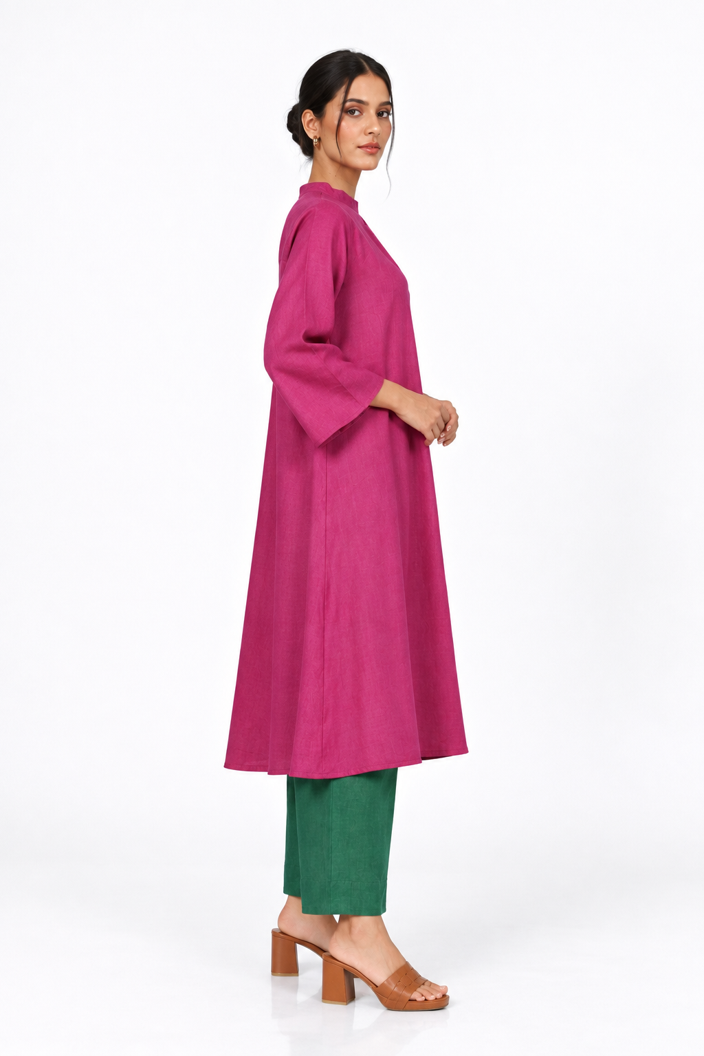 Side view of Gulbahar Rani pink flared linen tunic set with bottle green pants
