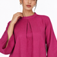Close-up of Gulbahar Rani pink linen tunic neckline and front pleat detail