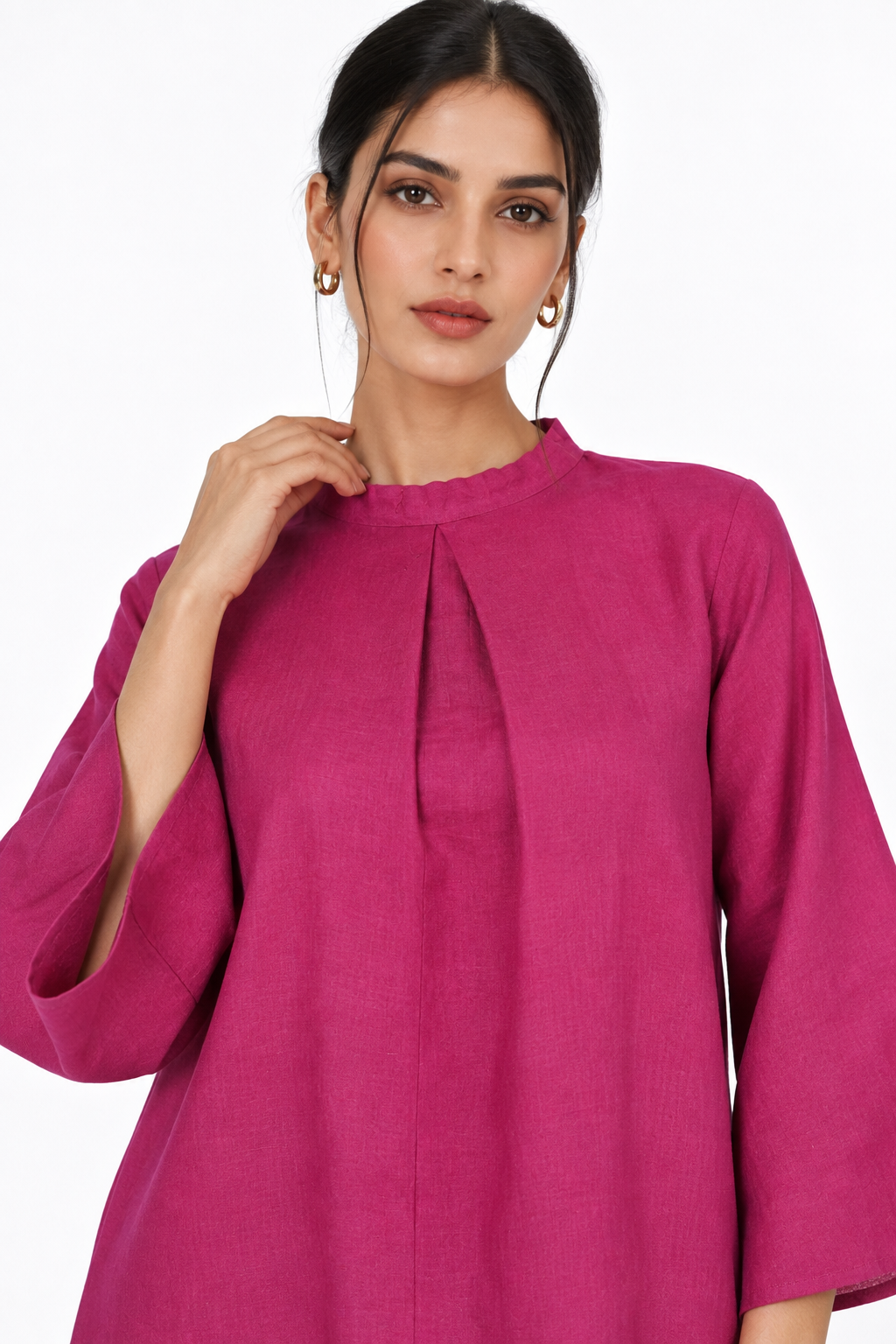 Close-up of Gulbahar Rani pink linen tunic neckline and front pleat detail