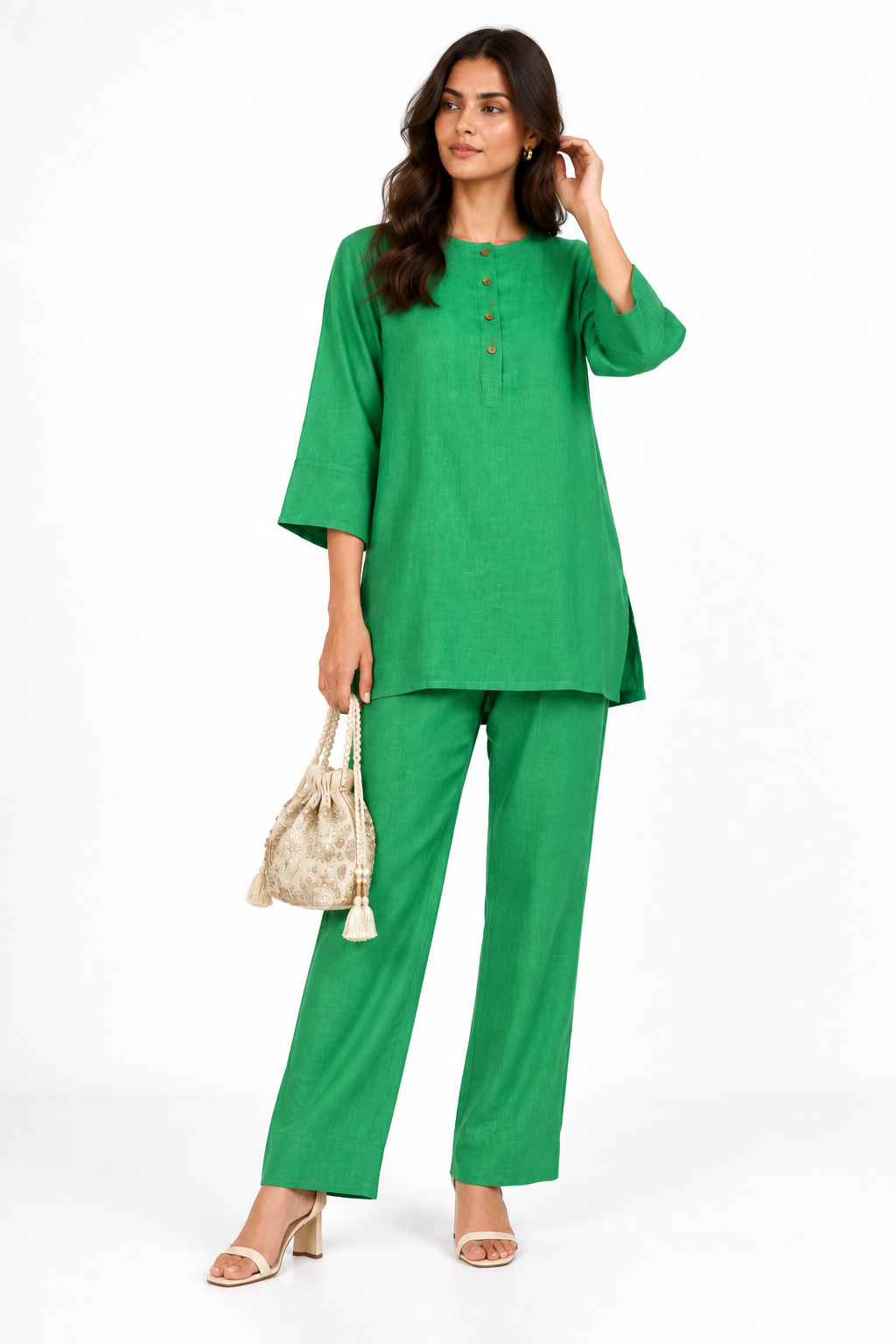Harit green linen kurta set for women styled with festive potli bag