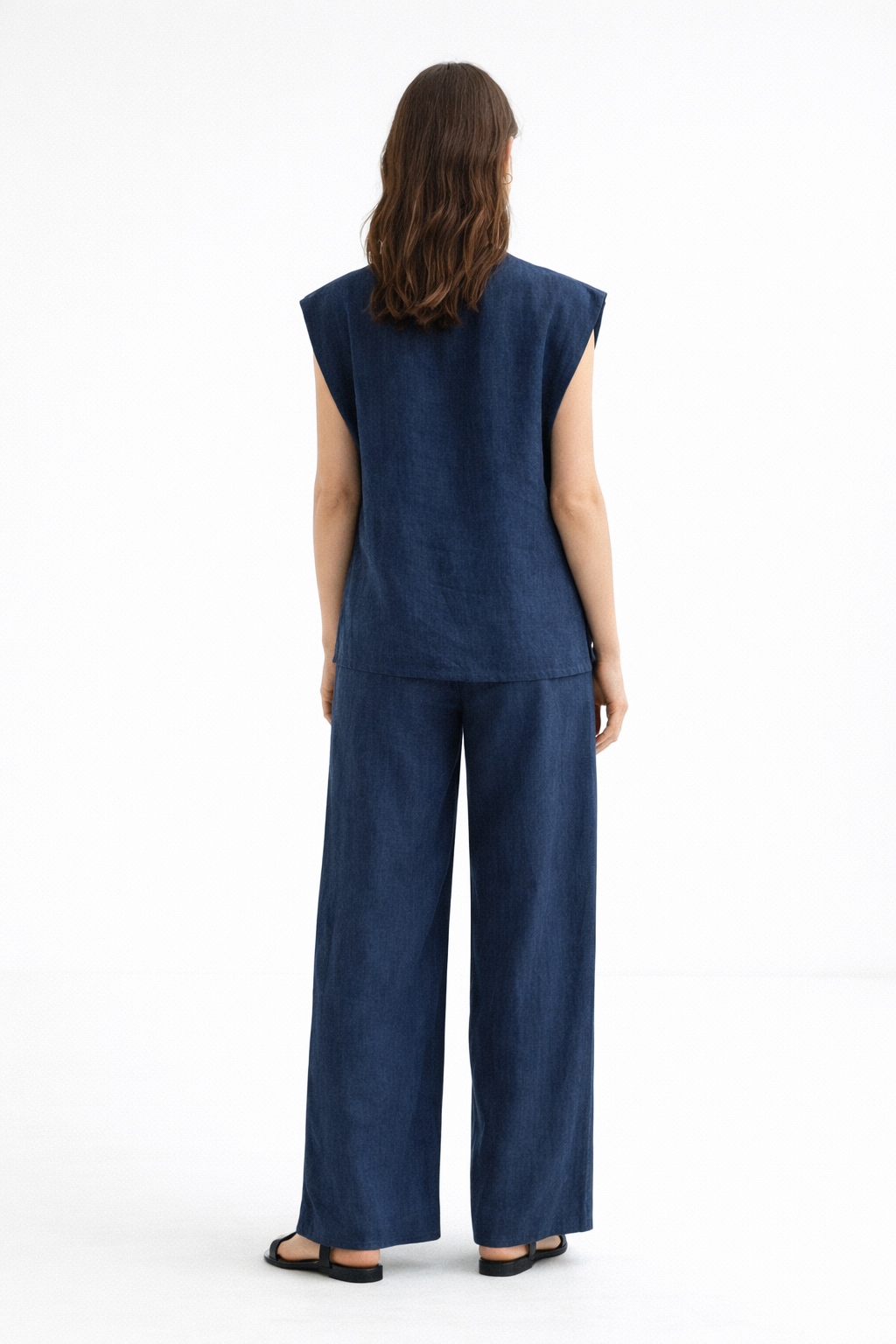 Back view of Ira Neel linen pants showing half elastic waistband and relaxed fit