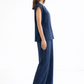 Side view of Ira Neel linen set highlighting the relaxed vest drape and fluid wide-leg pants