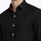Close-up of pure linen fabric texture on black men’s linen shirt