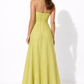 Back view of Lime Aura Linen Dress with clean strapless back and flowing hem