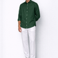 Model wearing alpine green linen shirt for men from LININ