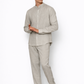 Model wearing ash grey linen pants for men from LININ