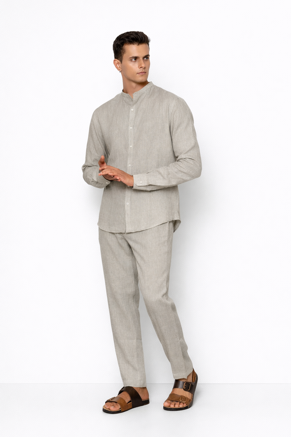 Model wearing ash grey linen pants for men from LININ