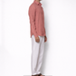 Model wearing burnt rose linen shirt for men from LININ side profile