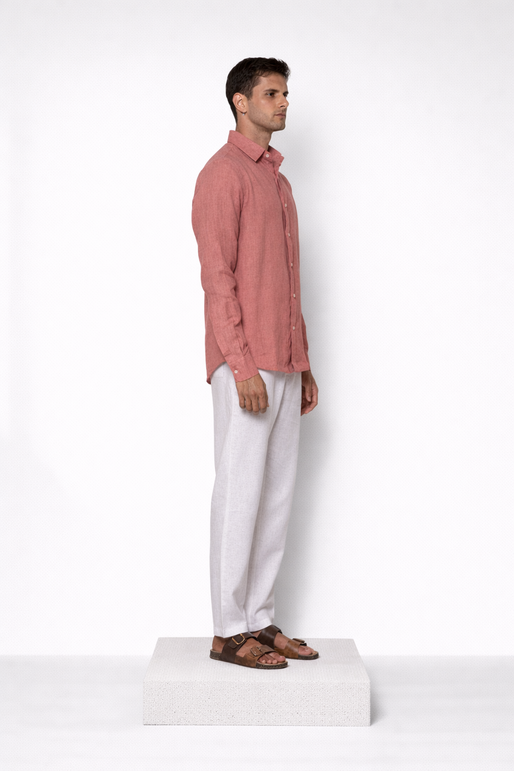 Model wearing burnt rose linen shirt for men from LININ side profile