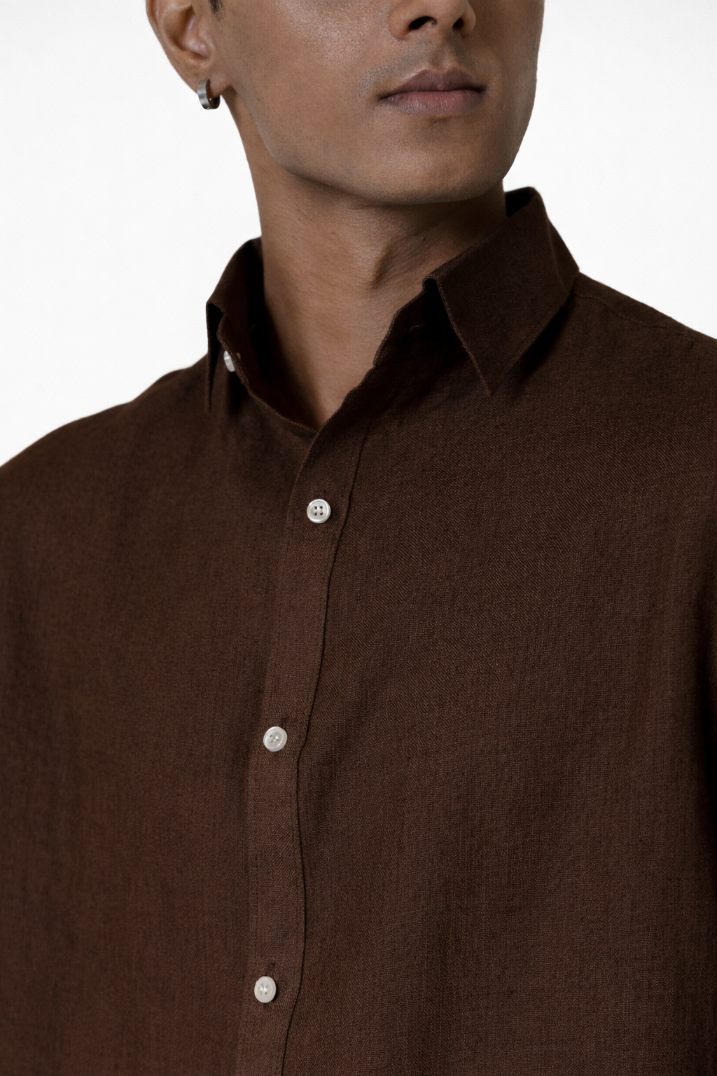 Close-up of chocolate brown linen fabric texture on men’s shirt by LININ