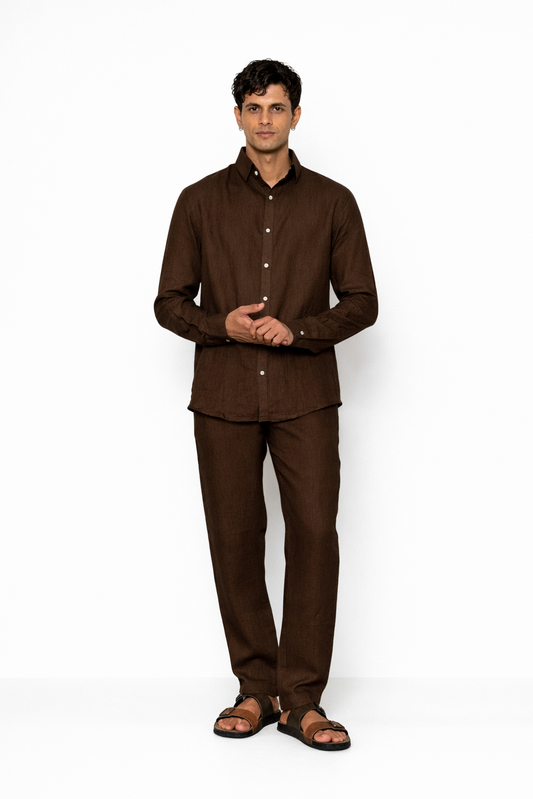 Model wearing chocolate brown linen pants for men from LININ