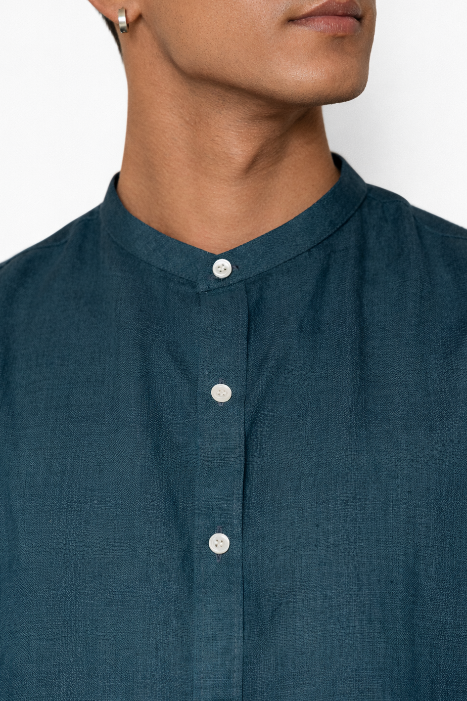 Close-up of indigo linen fabric and Chinese collar detail by LININ