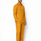 Side profile of mustard linen pants for men by LININ