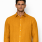Close-up of linen fabric texture on mustard men’s shirt by LININ