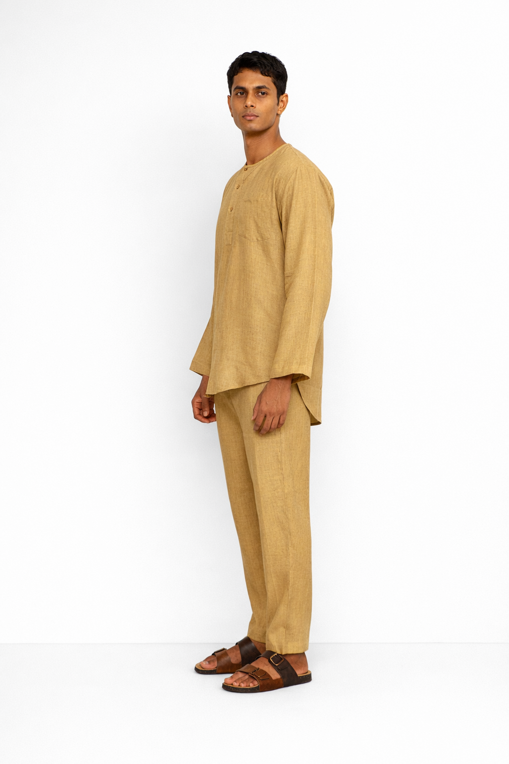 Side profile of ochre linen pants for men by LININ