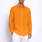 Close-up of linen fabric texture on orange men’s shirt by LININ