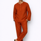 Model wearing rust linen pants for men from LININ