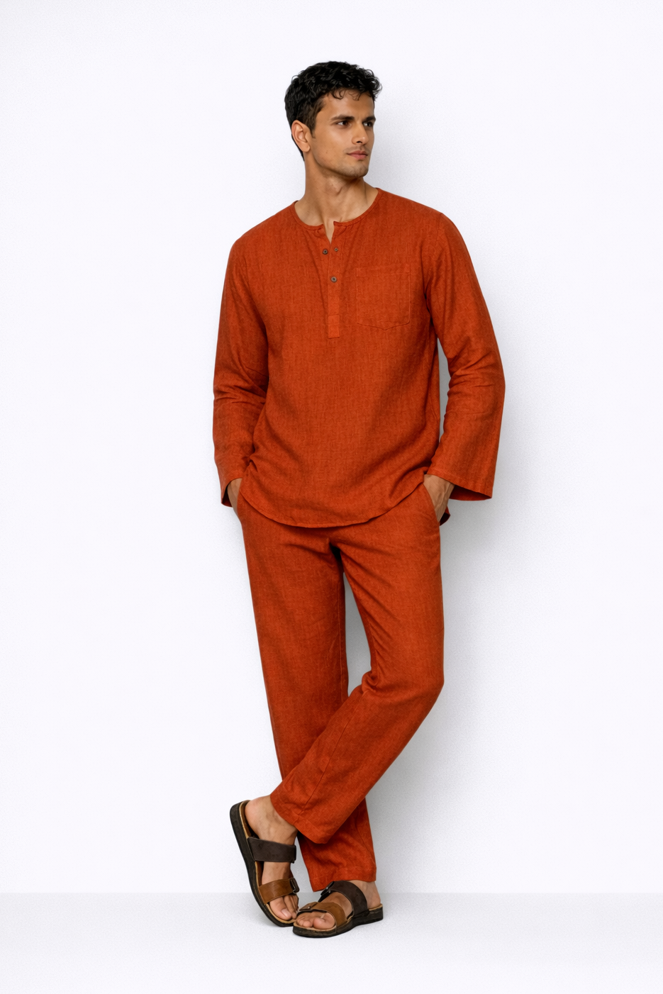 Model wearing rust linen pants for men from LININ