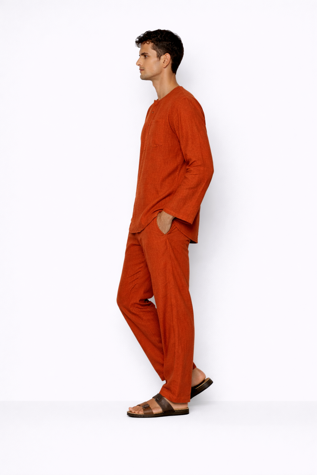 Side profile of rust linen pants for men by LININ