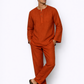 Model wearing rust linen short kurta set for men from LININ