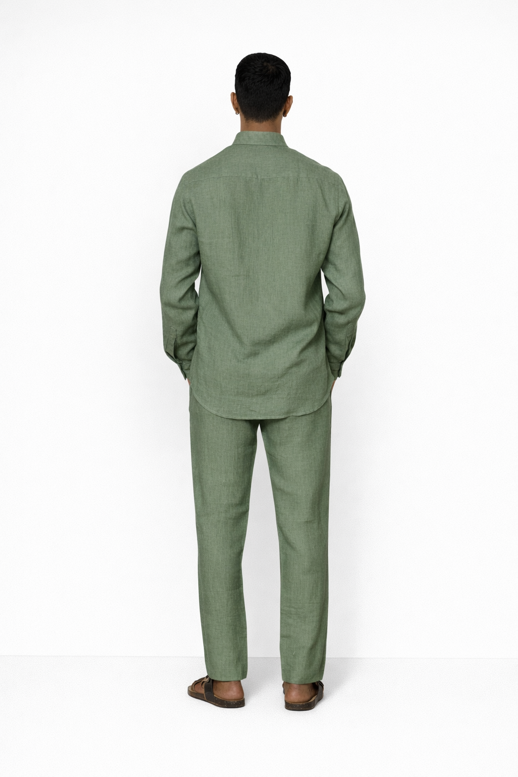 Back view of sage green men’s linen pants by LININ