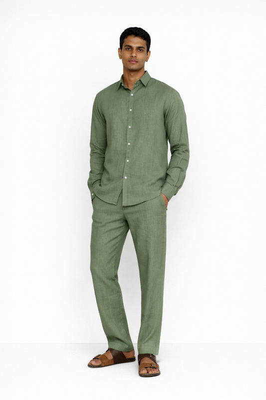 Model wearing sage green linen pants for men from LININ