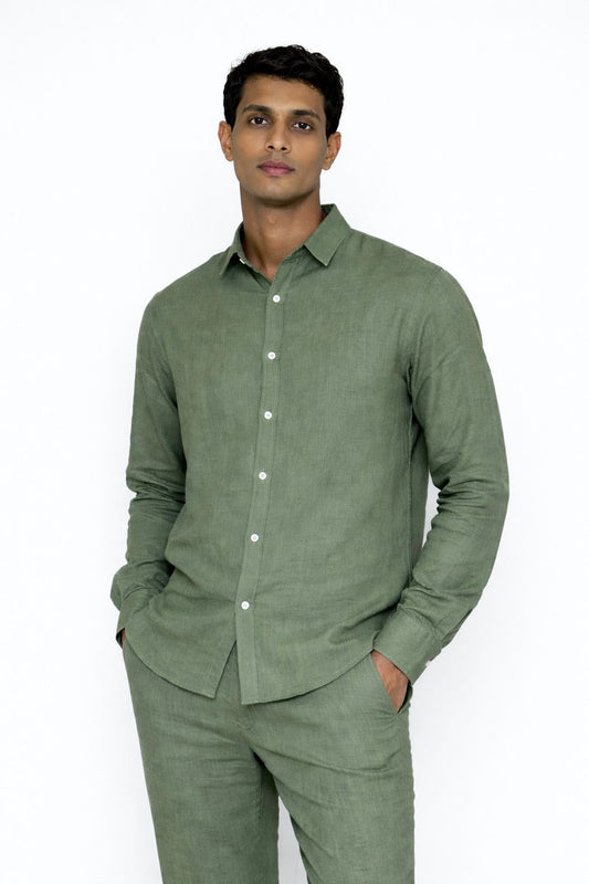 Close-up of linen fabric texture on sage green men’s shirt by LININ