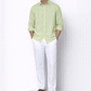 Model wearing willow green linen shirt for men from LININ