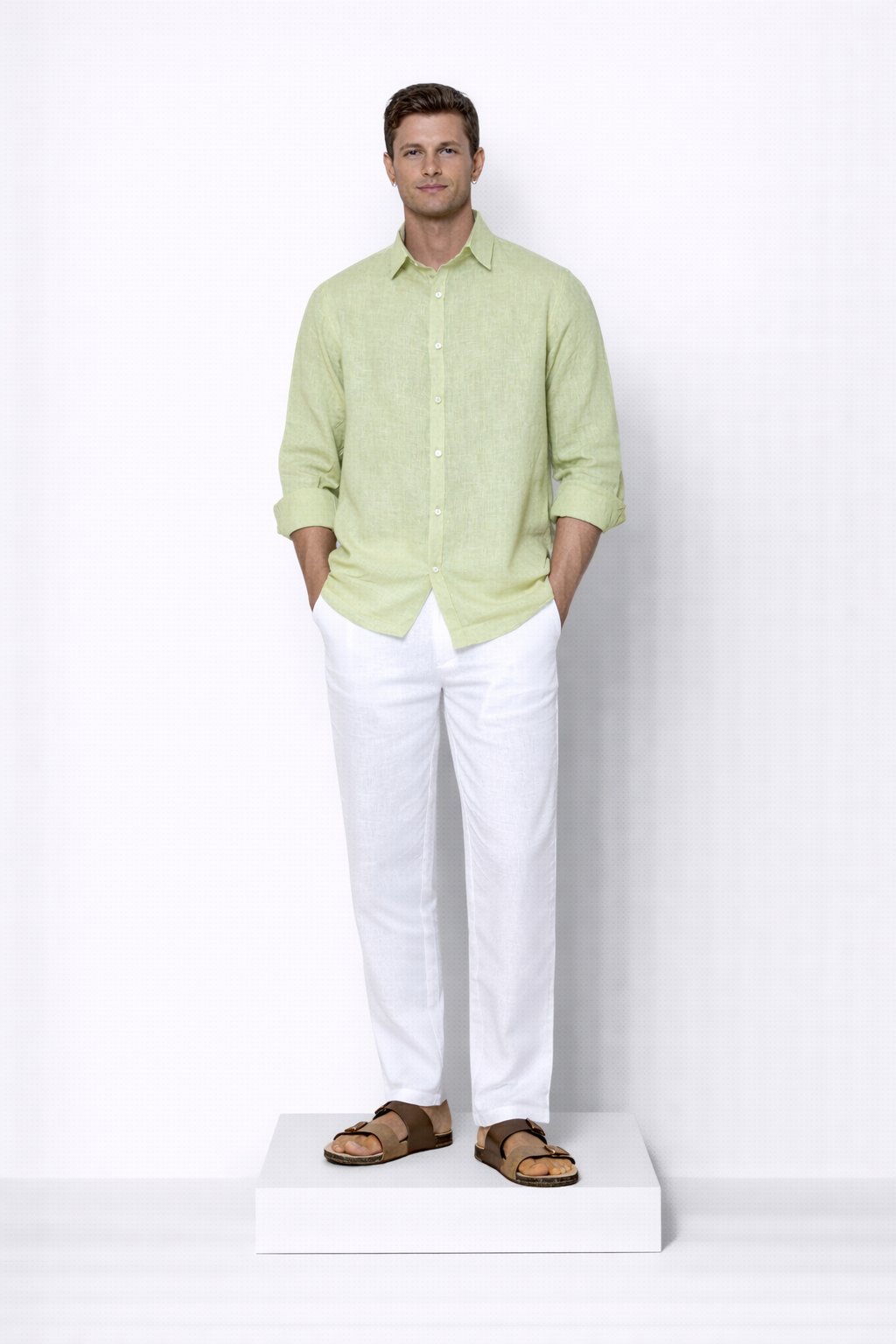 Model wearing willow green linen shirt for men from LININ