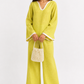 Meher lime linen set for women styled with a festive pearl bag