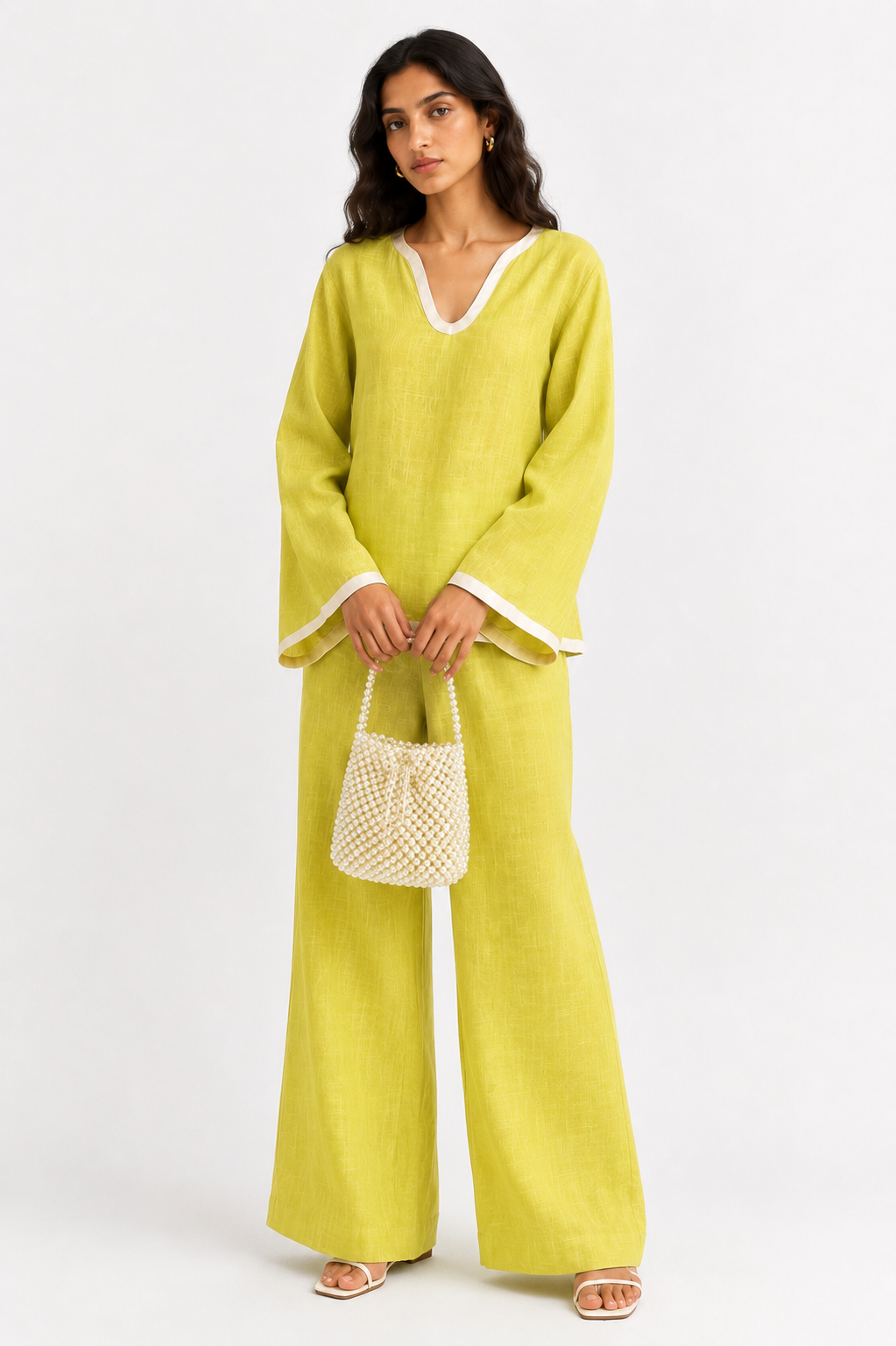 Meher lime linen set for women styled with a festive pearl bag