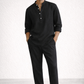 Midnight black linen short kurta set for men with hands outside pockets