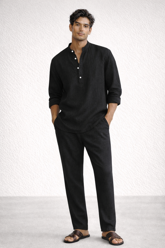 Midnight black linen short kurta set for men with hands outside pockets