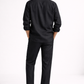 Back view of men’s midnight black pure linen overshirt set with relaxed silhouette