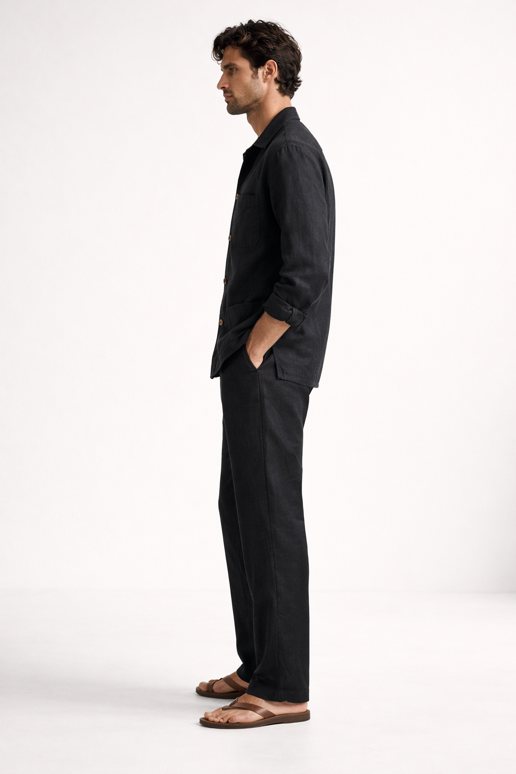 Side view of midnight black pure linen overshirt set showing breathable fabric and straight-fit trousers