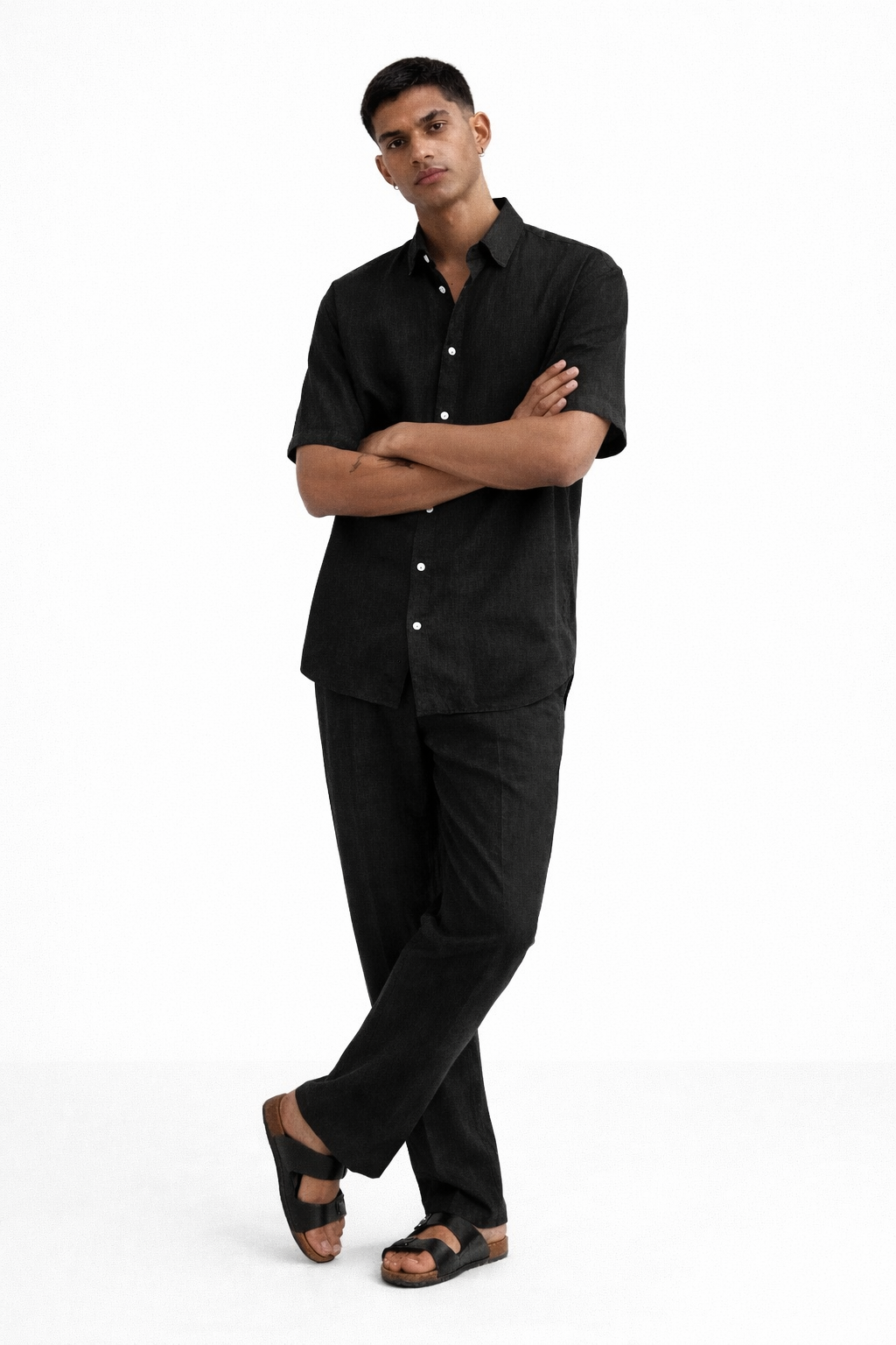 Men wearing midnight black linen shirt and pants set in relaxed standing pose