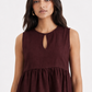 Close-up of Mulberry Muse linen peplum top with keyhole neckline