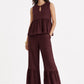 Woman wearing Mulberry Muse pure linen co-ord set in rich mulberry colour