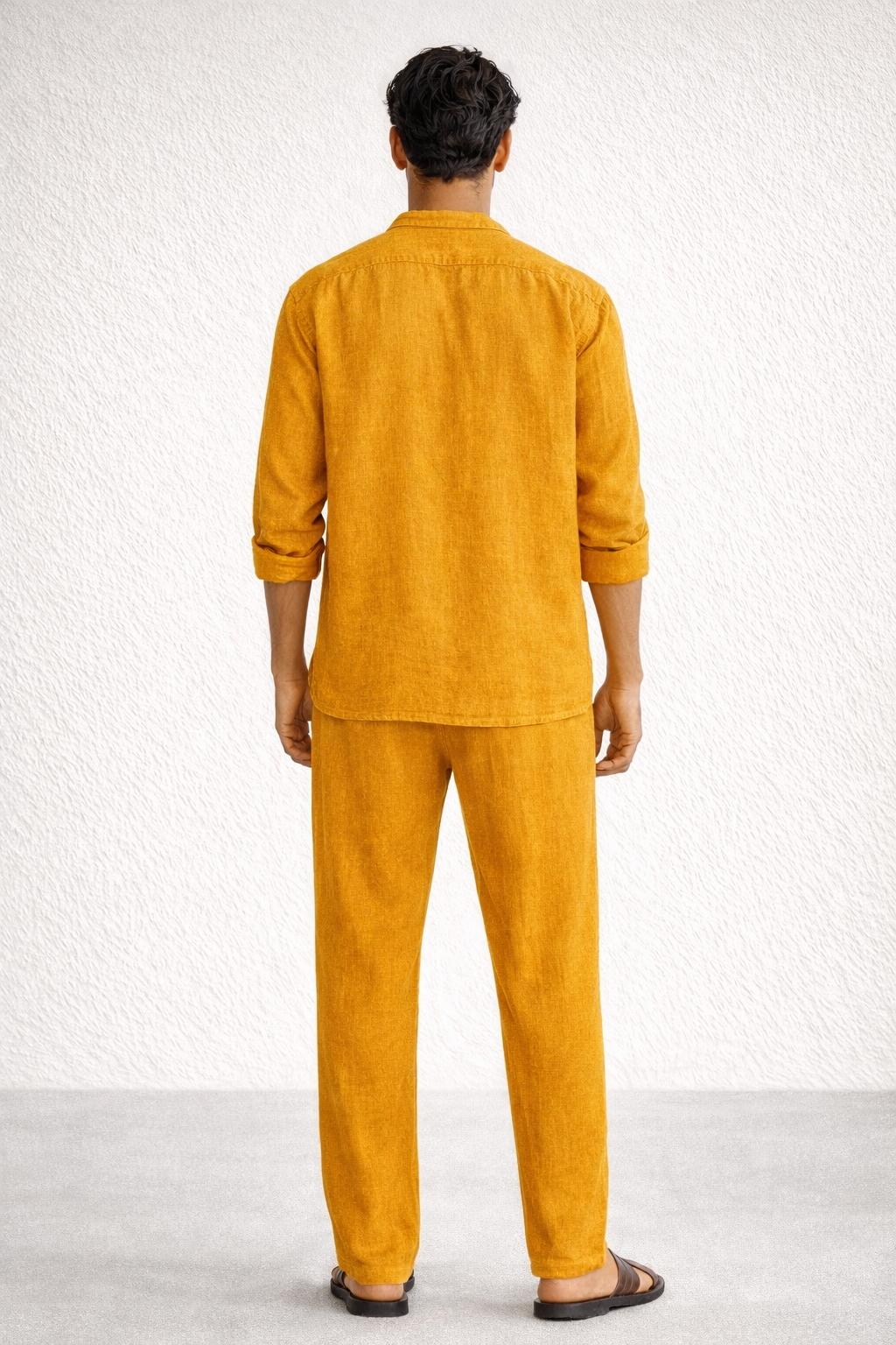 Back view of mustard yellow linen short kurta set for men
